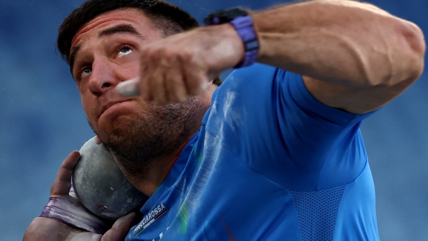 Italy's athlete Leonardo Fabbri competes in the men's shot put qualification during the European Athletics Championships at the Olympic stadium in Rome on June 7, 2024. (Photo by Anne-Christine POUJOULAT / AFP)