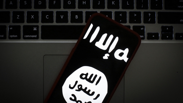 The Islamic State logo is seen on a portable mobile device in this photo illustration on January 22, 2019. (Photo by Jaap Arriens/NurPhoto) (Photo by Jaap Arriens / NurPhoto / NurPhoto via AFP)