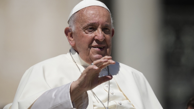 Pope Francis salutes faithful at the end of his weekly general audience in St. Peter's Square, at the Vatican, Wednesday, June 5, 2024. (AP Photo/Andrew Medichini)