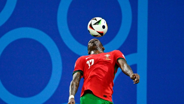 Portugal's forward #17 Rafael Leao chest controls the ball during the UEFA Euro 2024 Group F football match between Portugal and the Czech Republic at the Leipzig Stadium in Leipzig on June 18, 2024. (Photo by JOHN MACDOUGALL / AFP)