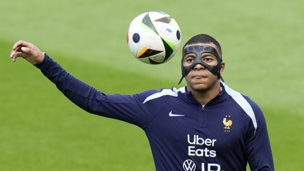 France's Kylian Mbappe controls the ball during a training session in Paderborn, Germany, Sunday, June 23, 2024. France will play against Poland during their Group D soccer match at the Euro 2024 soccer tournament on June 25. (AP Photo/Hassan Ammar)