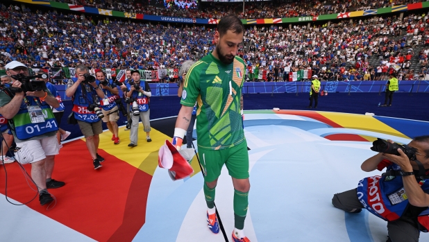 BERLIN, GERMANY - JUNE 29: Gianluigi Donnarumma of Italy, looks dejected after the team's elimination from the tournament following the UEFA EURO 2024 round of 16 match between Switzerland and Italy at Olympiastadion on June 29, 2024 in Berlin, Germany. (Photo by Stu Forster/Getty Images)