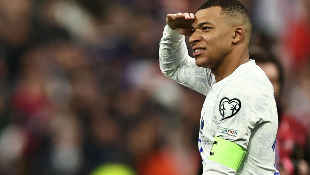 (FILES) France's forward Kylian Mbappe celebrates the 4-0 at the end of the UEFA Euro 2024 qualification football match between France and Netherlands at the Stade de France in Saint-Denis, north of Paris, on March 24, 2023. France will be facing Portugal's team in Hamburg, northern Germany on July 5, 2024, during the UEFA Euro 2024 quarter final. France's national football team headcoach Didier Deschamps reflects on the team's best matches in an interview with AFP. (Photo by Anne-Christine POUJOULAT / AFP)