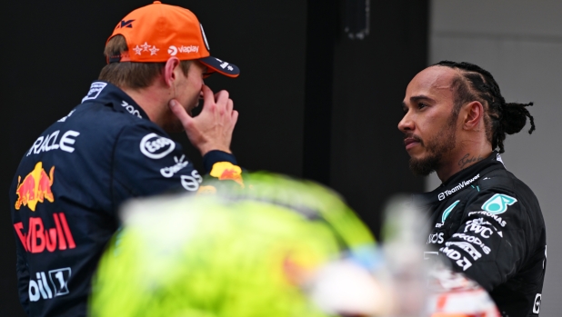 BARCELONA, SPAIN - JUNE 23: Race winner Max Verstappen of the Netherlands and Oracle Red Bull Racing and Third placed Lewis Hamilton of Great Britain and Mercedes celebrate in parc ferme during the F1 Grand Prix of Spain at Circuit de Barcelona-Catalunya on June 23, 2024 in Barcelona, Spain. (Photo by Rudy Carezzevoli/Getty Images)