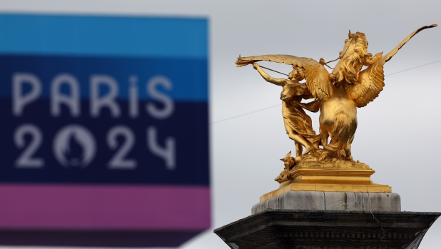 PARIS, FRANCE - JULY 26: Alexandre III bridge's golden statue is seen in front of a Paris 2024 Olympic Games logo prior to the opening ceremony of the Olympic Games Paris 2024 on July 26, 2024 in Paris, France. (Photo by Christian Petersen/Getty Images)