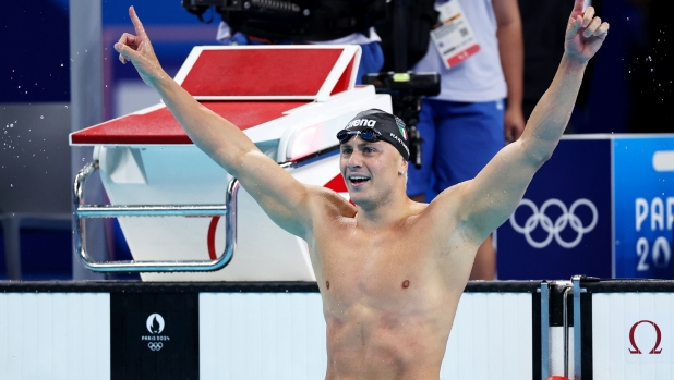 NANTERRE, FRANCE - JULY 28: Nicolo Martinenghi of Team Italy celebrates after winning gold in the Men?s 100m Breaststroke Final on day two of the Olympic Games Paris 2024 at Paris La Defense Arena on July 28, 2024 in Nanterre, France. (Photo by Quinn Rooney/Getty Images)