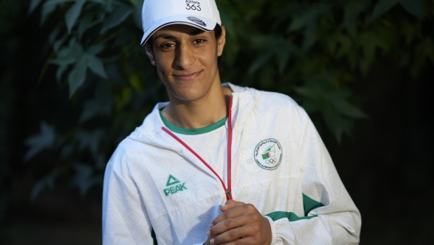 Algerian boxer Imane Khelif poses for a photo after an interview with SNTV at the 2024 Summer Olympics, Sunday, Aug. 4, 2024, in Paris, France. (AP Photo/Vadim Ghirda)