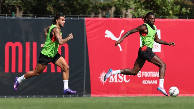 CAIRATE, ITALY - AUGUST 21: Rafael Leao and Theo Hernandez of AC Milan in action during a AC Milan training session at Milanello on August 21, 2024 in Cairate, Italy. (Photo by Claudio Villa/AC Milan via Getty Images)