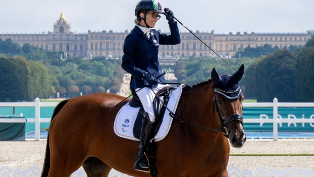 Italy's Sara Morganti riding Mariebelle reacts after winning the Silver medal in the Para Equestrian Individual Freestyle Event - Grade I at Chateau de Versailles at the Paris 2024 Paralympic Games, in Versailles, on September 7, 2024. (Photo by Ian RICE / AFP)