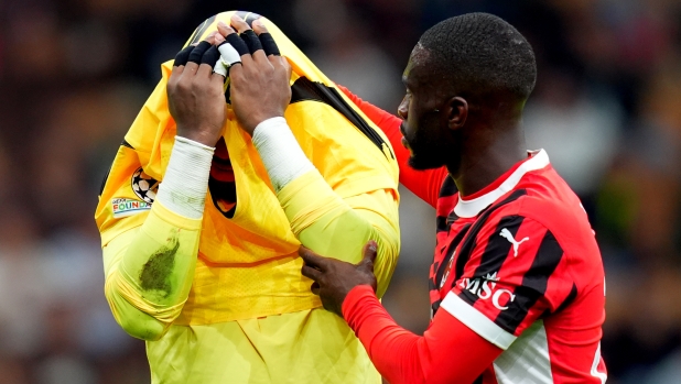 AC Milan's goalkeeper Mike Maignan , AC Milan's Fikayo Timori  during the Uefa Champions League soccer match between Milan and Liverpool at the San Siro Stadium in Milan, north Italy -Tuesday , September 17 2024. Sport - Soccer . (Photo by Spada/LaPresse)