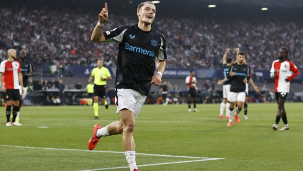 Bayer Leverkusen's German midfielder #10 Florian Wirtz celebrates scoring a goal during the UEFA Champions League 1st round day 1 football match between Feyenoord and Bayer Leverkusen at The De Kuip Stadium, in Rotterdam on September 19, 2024. (Photo by MAURICE VAN STEEN / ANP / AFP) / Netherlands OUT