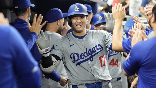 Los Angeles Dodgers' Shohei Ohtani (17) celebrates after hitting a home run during the sixth inning of a baseball game against the Miami Marlins, Thursday, Sept. 19, 2024, in Miami. (AP Photo/Marta Lavandier)