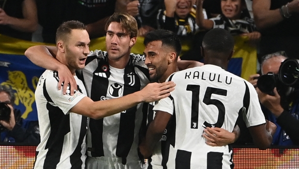 Juventus' Argentine forward #11 Nicolas Gonzalez (2ndR) celebrates with teammates after scoring his team's third goal during the UEFA Champions League 1st round day 1 football match between Juventus FC and PSV Eindhoven, at the Juventus Stadium in Turin on September 17, 2024. (Photo by Isabella BONOTTO / AFP)