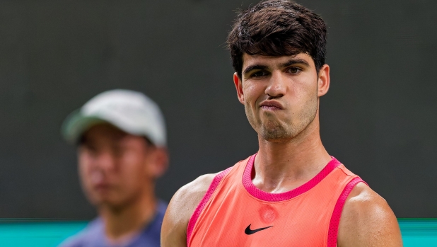 epaselect epa11645447 Carlos Alcaraz of Spain grimaces during his Men's Singles third round match against Yibing Wu of China at the Shanghai Masters tennis tournament in Shanghai, China, 06 October 2024.  EPA/ALEX PLAVEVSKI