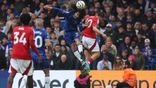 epa11645692 Marc Cucurella of Chelsea (C) in action against Jota Silva of Nottingham Forest (R) during the English Premier League soccer match between Chelsea FC and Nottingham Forest, in London, Britain, 06 October 2024.  EPA/NEIL HALL EDITORIAL USE ONLY. No use with unauthorized audio, video, data, fixture lists, club/league logos, 'live' services or NFTs. Online in-match use limited to 120 images, no video emulation. No use in betting, games or single club/league/player publications.