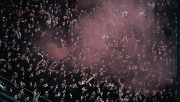 Fans of AC Milan are seen during the UEFA Champions League 2024/25 League Phase MD2 match between Bayer 04 Leverkusen and AC Milan at BayArena in Leverkusen, Germany, on October 1, 2024. (Photo by Hesham Elsherif/NurPhoto) (Photo by Hesham Elsherif / NurPhoto / NurPhoto via AFP)