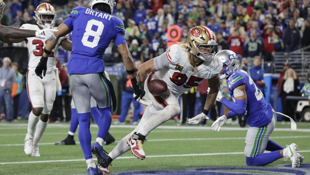 San Francisco 49ers tight end George Kittle reacts after scoring during the second half of an NFL football game against the Seattle SeahawksThursday, Oct. 10, 2024, in Seattle. (AP Photo/John Froschauer)