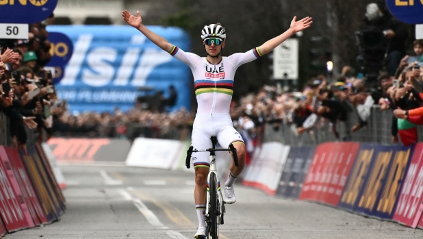 UAE Team Emirates team's Slovenian rider Tadej Pogacar cycles to the finish line to win the 118th edition of the Giro di Lombardia (Tour of Lombardy), a 252km cycling race from Bergamo to Como on October 12, 2024. (Photo by Marco BERTORELLO / AFP)