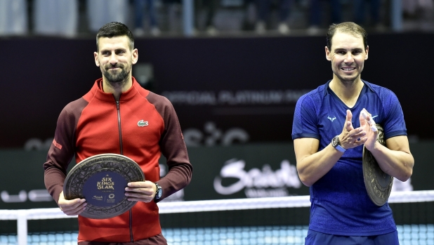 epa11669383 Novak Djokovic of Serbia (L) and Rafel Nadal of Spain hold their trophies after their third place match at the Six Kings Slam exhibition tennis tournament in Riyadh, Saudi Arabia, 19 October 2024.  EPA/STR