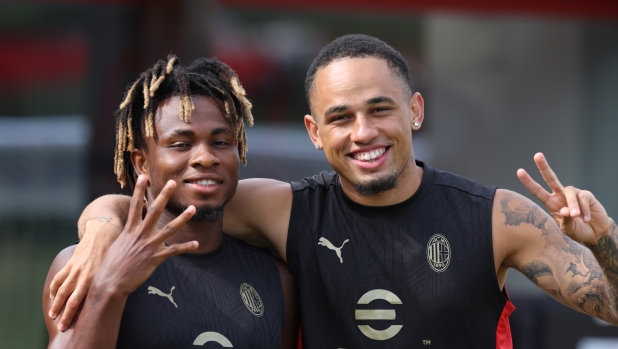 CAIRATE, ITALY - AUGUST 15: Samuel Chukwueze and Noah Okafor of AC Milan pose for a photo during a AC Milan training session at Milanello on August 15, 2024 in Cairate, Italy. (Photo by Claudio Villa/AC Milan via Getty Images)