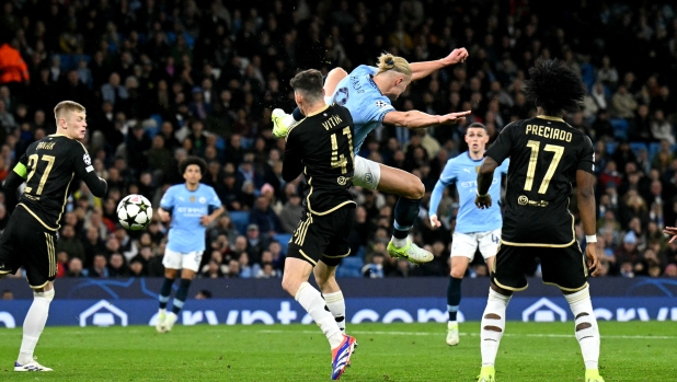 Manchester City's Norwegian striker #09 Erling Haaland scores the team's second goal during the UEFA Champions League football match between Manchester City and Sparta Prague at the Etihad Stadium in Manchester, north west England, on October 23, 2024. (Photo by Oli SCARFF / AFP)