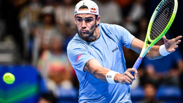 Italy's Matteo Berrettini hits a return to Netherlands' Botic van De Zandschulp during their men's singles match at the Japan Open tennis tournament at Ariake Coliseum in Tokyo on September 25, 2024. (Photo by Yuichi YAMAZAKI / AFP)