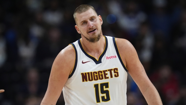 Denver Nuggets center Nikola Jokic reacts after arguing for a call with a referee in the second half of an NBA basketball game against the Oklahoma City Thunder, Thursday, Oct. 24, 2024, in Denver. (AP Photo/David Zalubowski)