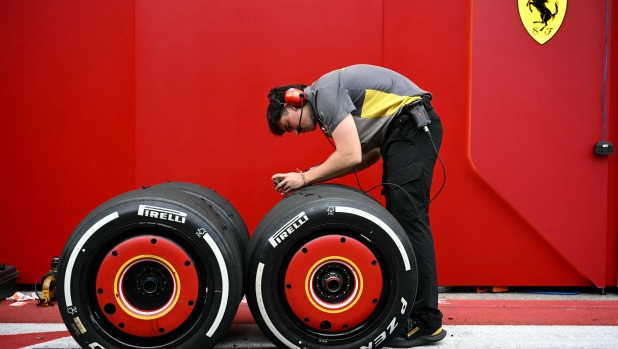 A Ferrari mechanic works on tires during the practice session for the United States Formula One Grand Prix at the Circuit of the Americas in Austin, Texas, on October 18, 2024. (Photo by ANGELA WEISS / AFP)