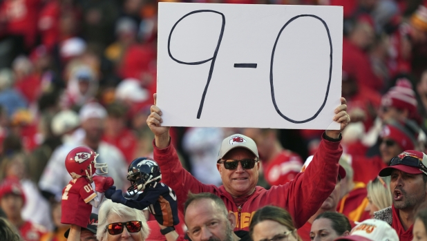 A fan holds up a sign following an NFL football game between the Kansas City Chiefs and the Denver Broncos Sunday, Nov. 10, 2024, in Kansas City, Mo. The Chiefs won 16-14. (AP Photo/Charlie Riedel)