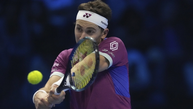 Norway's Casper Ruud returns the ball to Germany's Alexander Zverev during their singles tennis match of the ATP World Tour Finals at the Inalpi Arena, in Turin, Italy, Wednesday, Nov. 13, 2024. (AP Photo/Antonio Calanni)