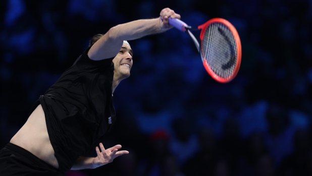 TURIN, ITALY - NOVEMBER 16: Taylor Fritz of United States serves against Alexander Zverev of Germany during the Men's Semi Final match during Day Seven of the Nitto ATP finals 2024 at the Inalpi Arena on November 16, 2024 in Turin, Italy. (Photo by Clive Brunskill/Getty Images)