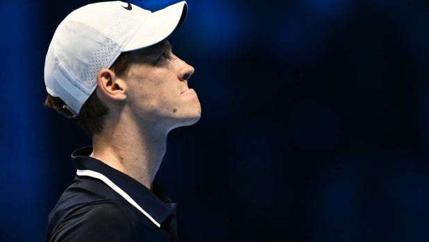 Italy's Jannik Sinner reacts during his match against Australia's Alex de Minaur at the ATP Finals tennis tournament in Turin on November 10, 2024. (Photo by Marco BERTORELLO / AFP)