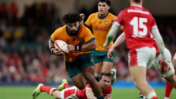 CARDIFF, WALES - NOVEMBER 17: Zane Nonggorr of Australia runs with the ball after evading the tackle attempt of Rhodri Williams of Wales during the Autumn Nations Series 2024 match between Wales and Australia at the Principality Stadium on November 17, 2024 in Cardiff, Wales. (Photo by Michael Steele/Getty Images)