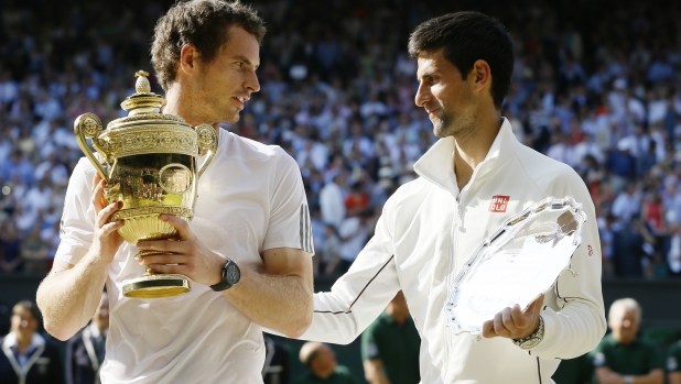 Andy Murray of Britain poses with the trophy after defeating Novak Djokovic of Serbia during the Men's singles final match at the All England Lawn Tennis Championships in Wimbledon, London, Sunday, July 7, 2013. (AP Photo/Kirsty Wigglesworth)