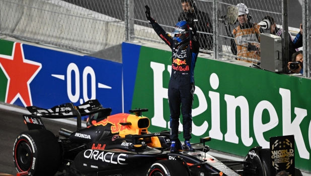 Red Bull Racing's Dutch driver Max Verstappen celebrates his fourth consecutive Formula One world title after the Las Vegas Formula One Grand Prix in Las Vegas, Nevada on November 23, 2024. (Photo by Patrick T. Fallon / AFP)