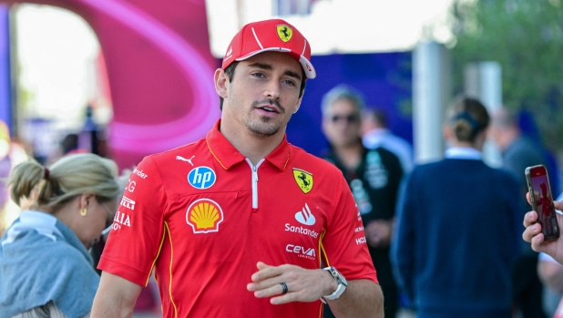 Ferrari's Monegasque driver Charles Leclerc arrives at Lusail International Circuit in Lusail, north of Doha, ahead of the first practice session of the Qatari Formula One Grand Prix on November 29, 2024. (Photo by Giuseppe CACACE / AFP)