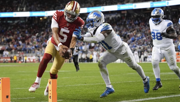 San Francisco 49ers quarterback Joshua Dobbs (5) scores a touchdown during the second half of an NFL football game against the Detroit Lions, Monday, Dec. 30, 2024, in Santa Clara, Calif. (AP Photo/Godofredo A. Vásquez)