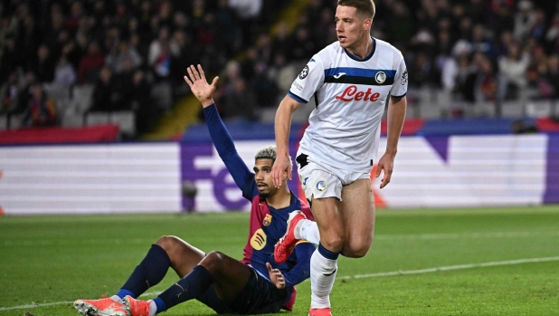 Atalanta's Croatian midfielder #08 Mario Pasalic (R) celebrates scoring their second goal during the UEFA Champions League, league phase football match between FC Barcelona and Atalanta BC at the Estadi Olimpic Lluis Companys in Barcelona on January 29, 2025. (Photo by JAVIER SORIANO / AFP)