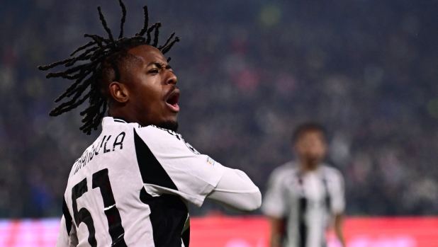 Juventus' Belgian forward #51 Samuel Mbangula celebrates scoring his team's second goal  during the UEFA Champions League knockout phase play-off 1st leg football match between Juventus and PSV Eindhoven at the Allianz stadium in Turin, on February 11, 2025. (Photo by Marco BERTORELLO / AFP)