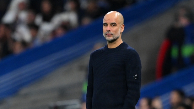 MADRID, SPAIN - FEBRUARY 19: Pep Guardiola, Manager of Manchester City, looks on during the UEFA Champions League 2024/25 League Knockout Play-off second leg match between Real Madrid C.F. and Manchester City at Santiago Bernabeu Stadium on February 19, 2025 in Madrid, Spain. (Photo by David Ramos/Getty Images)