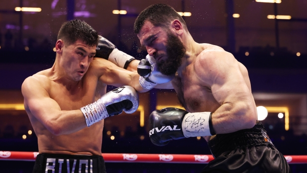 RIYADH, SAUDI ARABIA - FEBRUARY 22: Dmitrii Bivol punches Artur Beterbiev during the Undisputed IBF, IBO, WBC and WBO World Light Heavyweight Titles' fight between Artur Beterbiev and Dmitrii Bivol as part of Beterbiev v Bivol 2: The Last Crescendo at Kingdom Arena on February 22, 2025 in Riyadh, Saudi Arabia. (Photo by Richard Pelham/Getty Images)