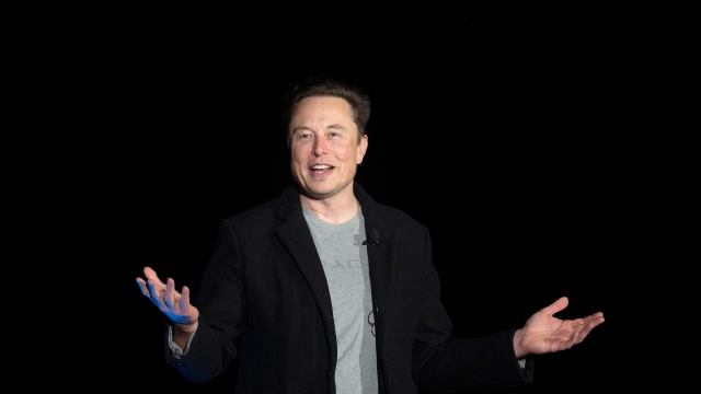 (FILES) In this file photo taken on February 10, 2022 Elon Musk gestures as he speaks during a press conference at SpaceX's Starbase facility near Boca Chica Village in South Texas. - US market regulators are probing whether Tesla boss Elon Musk and his brother violated insider trading rules in connection with whopping share sales last year, the Wall Street Journal reported on February 24, 2022. (Photo by JIM WATSON / AFP)