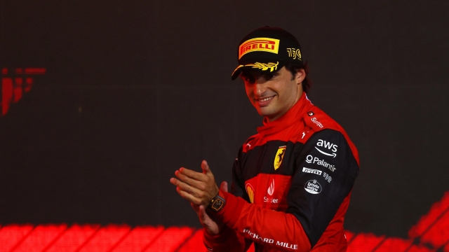 BAHRAIN, BAHRAIN - MARCH 20: Second placed Carlos Sainz of Spain and Ferrari celebrates on the podium during the F1 Grand Prix of Bahrain at Bahrain International Circuit on March 20, 2022 in Bahrain, Bahrain. (Photo by Lars Baron/Getty Images)