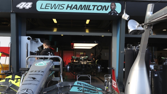 Mercedes mechanics prepare driver Lewis Hamilton's garage at the track ahead of the Australian Formula One Grand Prix in Melbourne, Australia, Thursday, April 7, 2022. (AP Photo/Asanka Brendon Ratnayake)