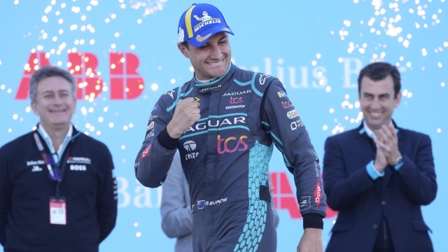 First placed, Mitch Evans, celebrates at the end of a Formula E Rome ePrix auto race in E.U.R., in Rome, Sunday, April 10, 2022. (AP Photo/Andrew Medichini)