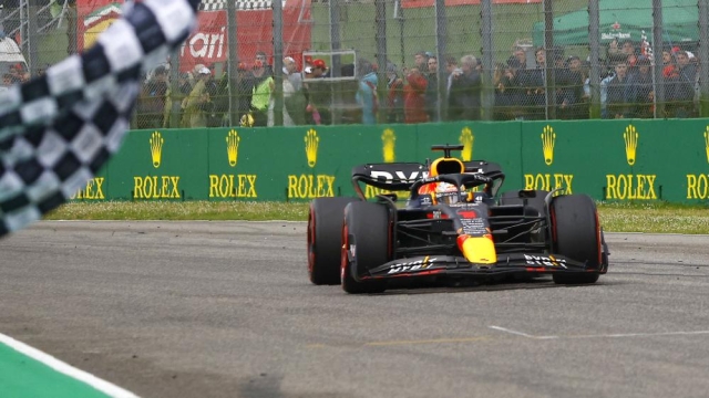 Red Bull driver Max Verstappen of the Netherlands crosses the finish line as he wins the Emilia Romagna Formula One Grand Prix, at the Enzo and Dino Ferrari racetrack in Imola, Italy, Sunday, April 24, 2022. (Guglielmo Mangiapane, Pool via AP)