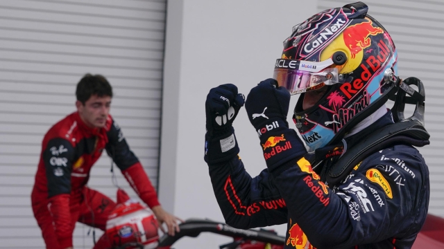 Red Bull driver Max Verstappen of the Netherlands celebrates after winning the Formula One Miami Grand Prix auto race over second placer finisher Ferrari driver Charles Leclerc of Monaco, left, at the Miami International Autodrome, Sunday, May 8, 2022, in Miami Gardens, Fla. (AP Photo/Darron Cummings)