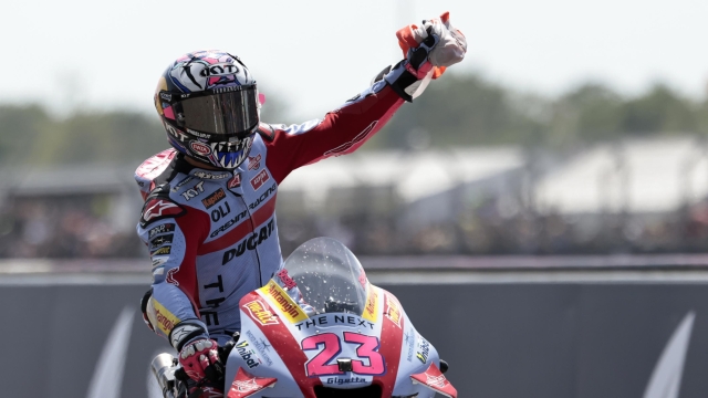 Race winner Italian rider Enea Bastianini of the Gresini Racing MotoGP celebrates after the MotoGP race of the French Motorcycle Grand Prix at the Le Mans racetrack, in Le Mans, France, Sunday, May 15, 2022. (AP Photo/Jeremias Gonzalez)