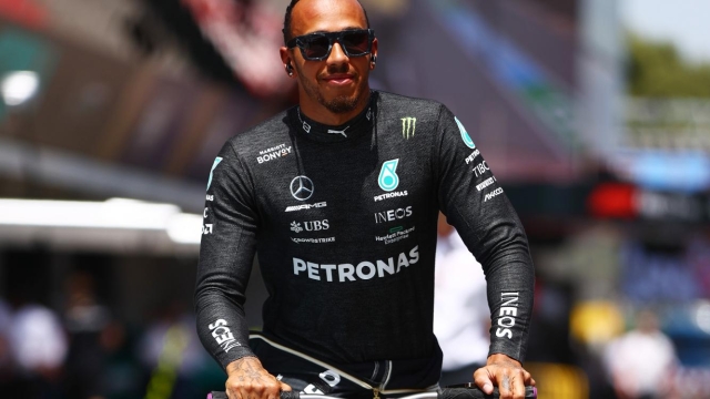 BARCELONA, SPAIN - MAY 22: Lewis Hamilton of Great Britain and Mercedes rides a scooter to the grid prior to the F1 Grand Prix of Spain at Circuit de Barcelona-Catalunya on May 22, 2022 in Barcelona, Spain. (Photo by Mark Thompson/Getty Images)