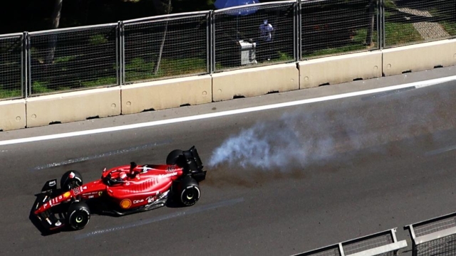 BAKU, AZERBAIJAN - JUNE 12: Smoke pours from the car of Charles Leclerc of Monaco driving the (16) Ferrari F1-75 as his engine fails leading to him retiring from the race during the F1 Grand Prix of Azerbaijan at Baku City Circuit on June 12, 2022 in Baku, Azerbaijan. (Photo by Clive Rose/Getty Images)